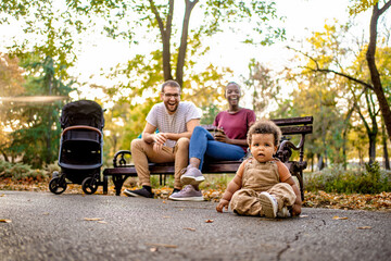 Family enjoying a sunny day in the park with laughter and joy
