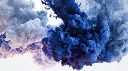 Billowing clouds of smoke in rich blue and soft white intertwine in a mesmerizing display. This captivating visual evokes a sense of movement and fluidity, highlighting color blending.