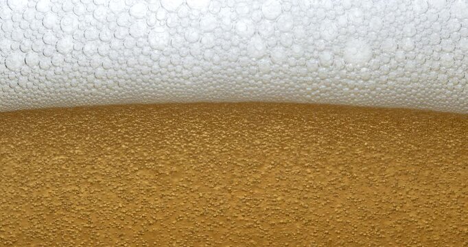 Slow Motion Macro Of Golden Beer With Foam And Rising Bubbles, Refreshing Cold Drink Close Up, Fizzy Carbonated Beverage Texture For Brewery, Bar, Pub, Oktoberfest And Alcohol Concept At 1000 Fps