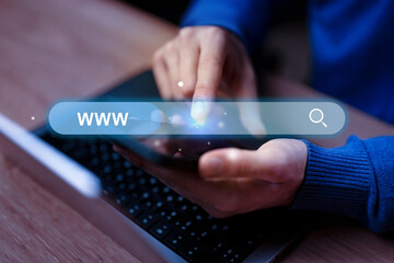 Searching for information online using a smartphone during evening hours while seated at a desk