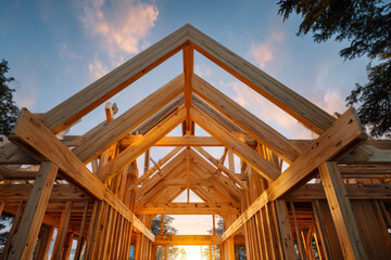 Obraz premium House frame construction at sunset