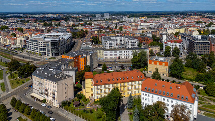 Aerial panorama of Wrocław city center, modern buildings, streets and historic townhouses, red rooftops, urban architecture, Lower Silesia, Poland, scenic city landscape view.