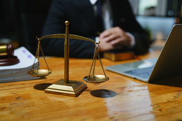 judge on wooden table And experienced lawyers meet with clients and give advice behind the scenes. legal services legal consulting concept