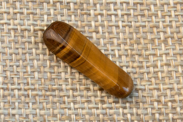 Natural mineral gem stone Tiger's eye Tigers eye, Tiger eye gemstone as nice background close up