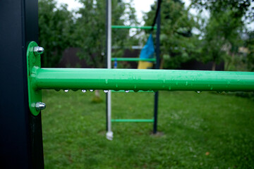 Outdoor children play structure with slide and ladders