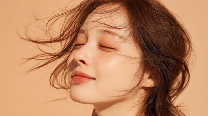 A serene portrait of a woman with flowing hair against a warm background, exuding a sense of calm and beauty.