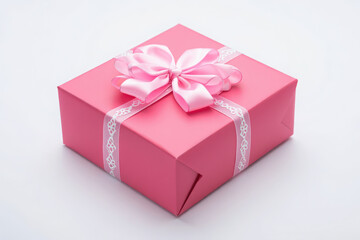Obraz premium Elegant pink gift box with satin ribbon and bow