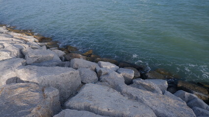Scene of Seaside rocks with some coastal waves