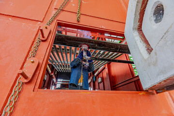 Welding male worker metal is part of machinery boiler coil tank construction repair inside