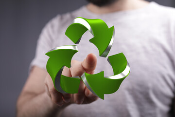 Eco-friendly concept.  Person interacts with a digital recycling sign. Sustainable future.