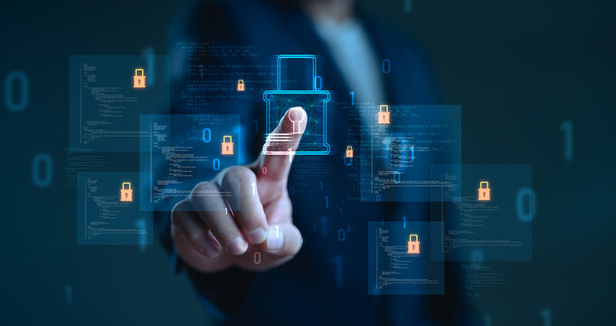 Businessman touching digital padlock icon on virtual screen with source code. Concept of cybersecurity, data protection, firewall, encryption, secure access and technology safety.