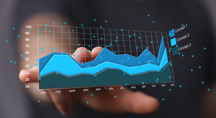 Stock photo of a hand interacting with a digital graph showing business growth over time.