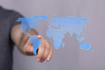 Hand interacting with a digital world map.  Global business, technology, and connection concepts.
