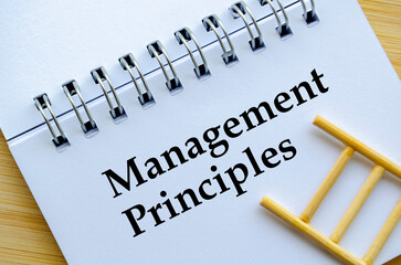 Management Principles, A professional notebook with ladder showing management principles version...