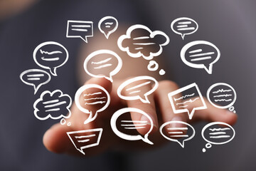 Abstract image of hand interacting with speech bubbles, representing communication and ideas.