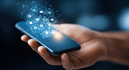 Hand holding a phone with digital app icons