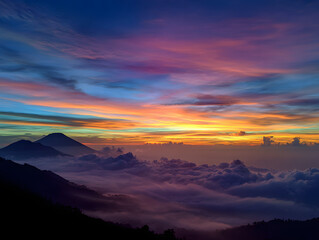Obraz premium Colorful Mountain Sunset with Purple Haze Above Cloud Cover