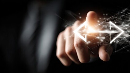 Businessman hand touching a glowing digital email icon for communication.