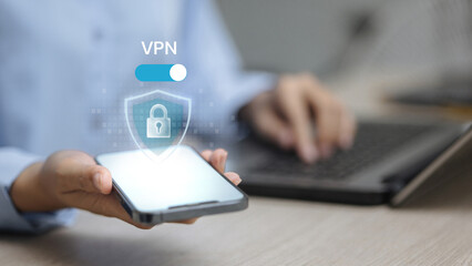 Hand holding smartphone with VPN shield lock icon, secure mobile internet connection, cyber security technology