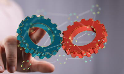 Image of two gears meshing, symbolizing teamwork, collaboration, and synergy.