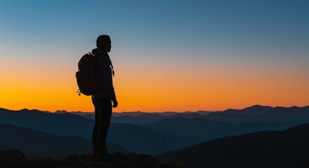 Silhouette of Traveler Enjoying Mountain Sunset.