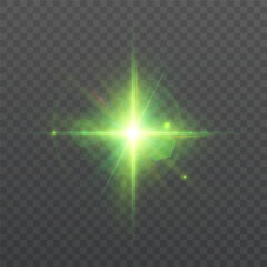 Bright magical star with glowing green rays and highlights on dark background. Shining Christmas light effect with bright glow for holiday and Christmas designs.