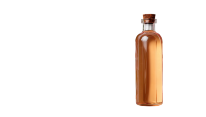 Amber glass bottle with cork stopper, filled with a light brown liquid.  A piece of paper or scroll is visible within the bottle