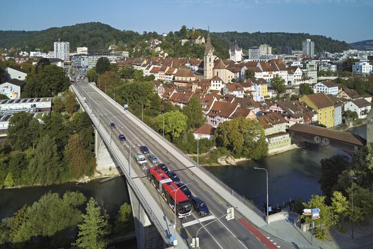 View of the old town with the parish church of Maria Himmelfahrt, in the foreground the high bridge, in the background the ruins of Stein Castle, formerly an administrative centre of the Habsburgs, on the right the river Limmat and the covered wooden bridge, Baden, Canton Aargau, Switzerland