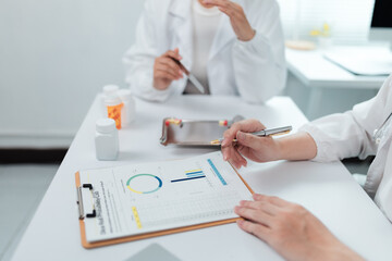 Medical professionals examining test results and having a discussion about the data in a laboratory...