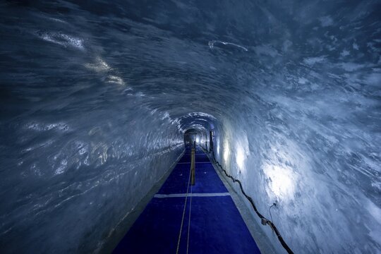 Artificial ice cave through the glacier ice, Mer de Glace, Montenvers, Chamonix, Haute-Savoie, France