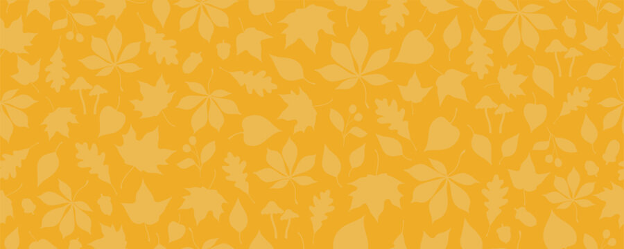 Seamless pattern with autumn leaves, acorns, berries and mushrooms on yellow background. Repeated seasonal texture. Autumn season and thanksgiving celebration banner