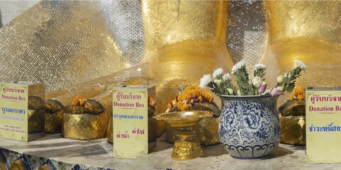 Feet of a 32 metre high standing Buddha decorated with glass mosaics and 24 carat gold, Luang Pho To or Phrasiariyametri, Wat Intharawihan, Bangkok, Thailand