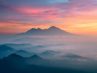 Majestic Mountain Range at Pink Sunset with Foggy Layers