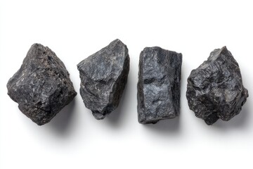 Naklejka premium Four dark gray rocks on a white background