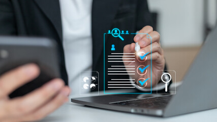 Businesswoman using laptop and smartphone with digital recruitment and HR management icons, AI technology for candidate selection, job application, and workforce