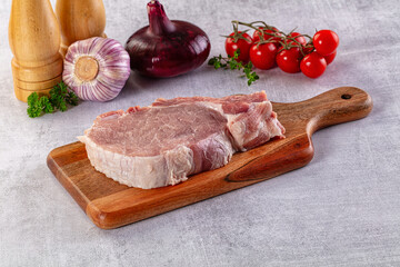 Raw pork steak with bone