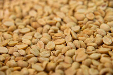 Dry peanuts with salt roasted without skin. Side view background. Healthy spices, nuts, seeds and plant products.