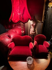 Cozy retro lounge with dramatic red lighting