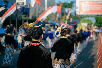 Traditional Cultural Parade with Participants in Elegant Clothing and Decorated Hair