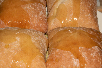 Close Up Macro of a Ciabatta Bread Roll Top Fluffy Baking with Olive Oil