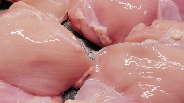 Raw chicken meat. Chunks of fresh organic meat. Prepare dish with chicken on pan. High quality 4k footage