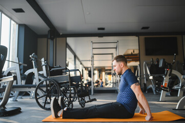 Man with disability doing rehabilitation exercises in the gym
