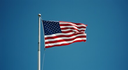 Fototapeta premium American flag waving in the bright blue sky, representing patriotism and national pride