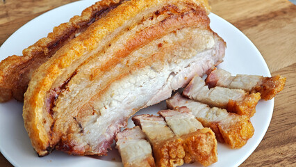 Crispy fried pork on white plate