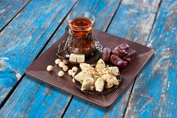 Traditional plate with sweet date fruits and tea