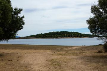 Nature's serenity embraced by calm waters at twilight near hidden lake