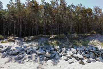 The dunes in Mielno, Poland, are protected by boulders that have been placed along the line separating the beach from the dunes