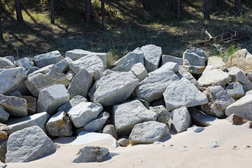 The stones have been placed there to protect the dunes from the sea waves in Mielno, Poland