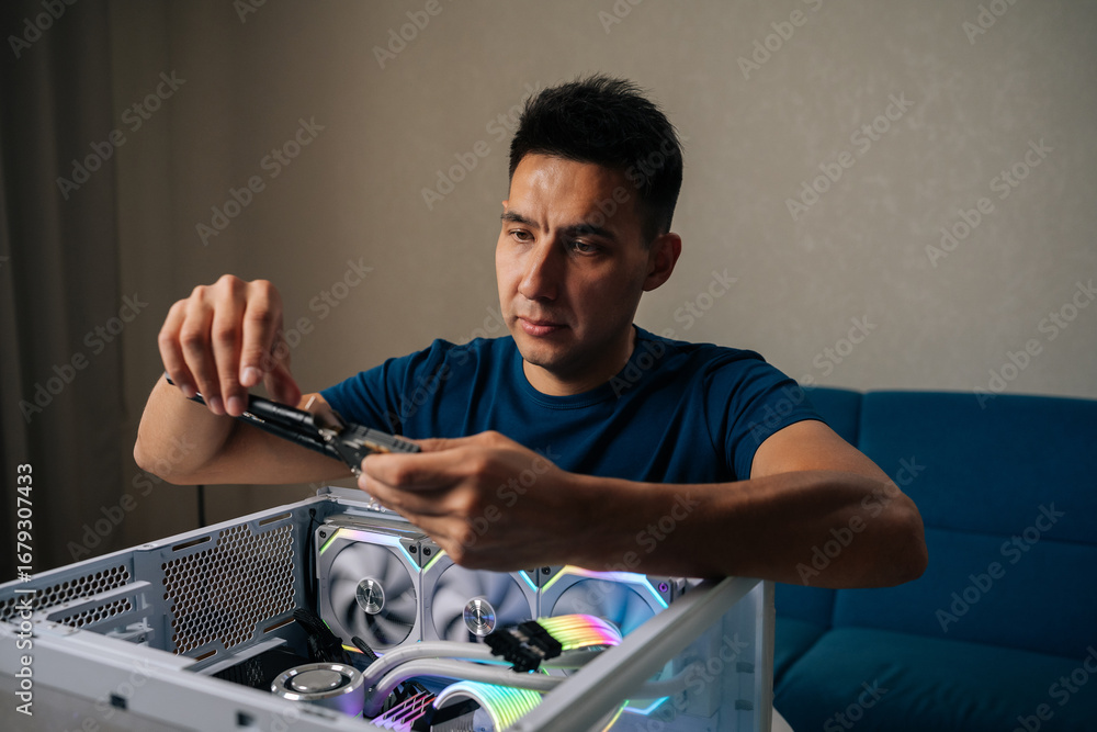 Fototapete Skilled computer technician inserting wireless network module inside custom desktop computer, enhancing system connectivity for reliable internet performance. Concept of modern technology.