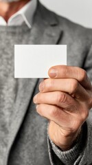 Elegant Hand Holding Blank White Paper for Text Mockup